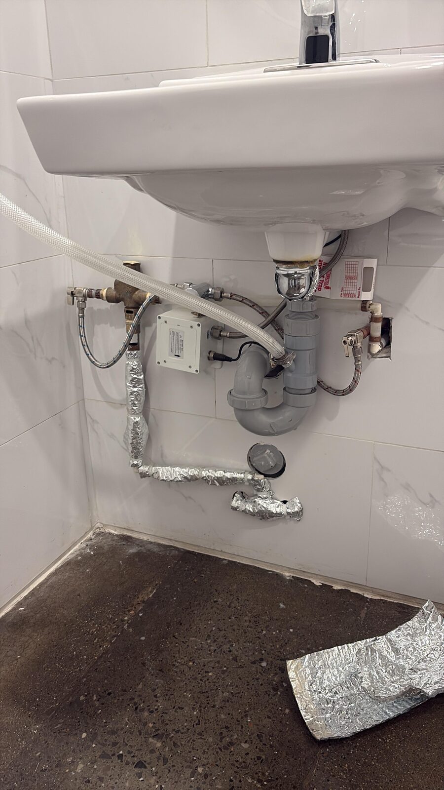 Finished sink drain trap and supply line install