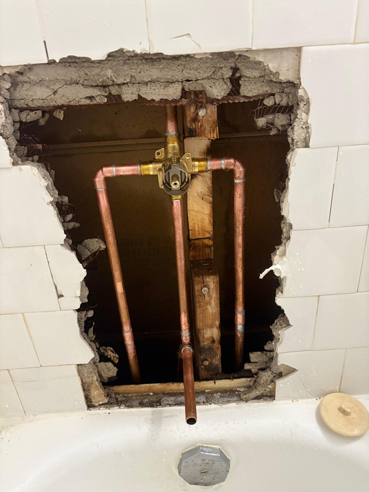 Copper tub and shower valve rough-in behind tile